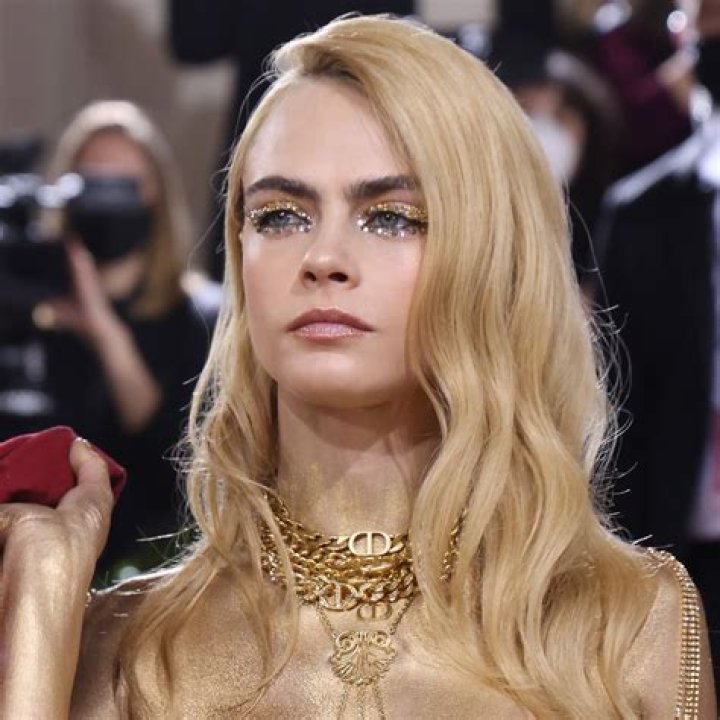Cara DeLevingne was painted gold and wore Dior pants at the Met Gala