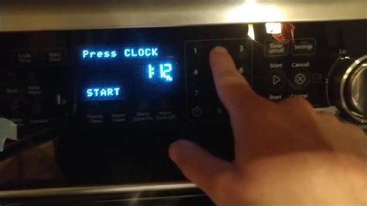 How do I set the clock on my Whirlpool oven?