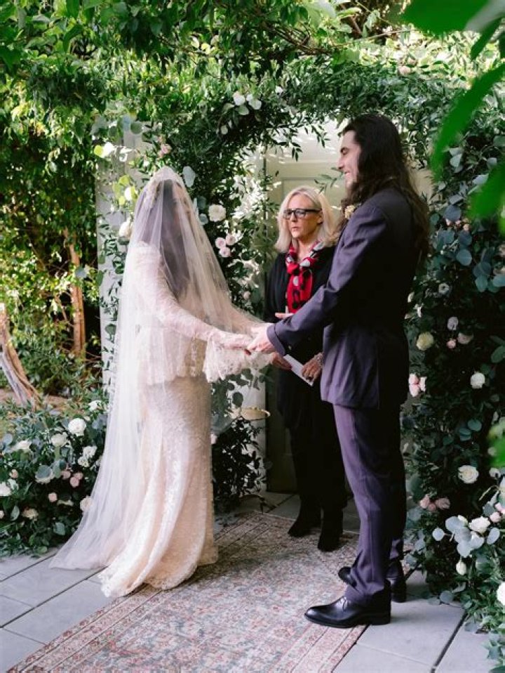 Kat Dennings & Andrew WK had a small wedding at home, the bride wore McQueen